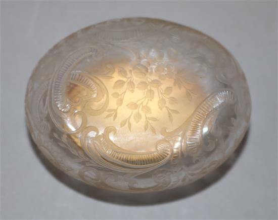 An early 20th century French 18ct gold mounted rock crystal oval snuff box, 2.25in.